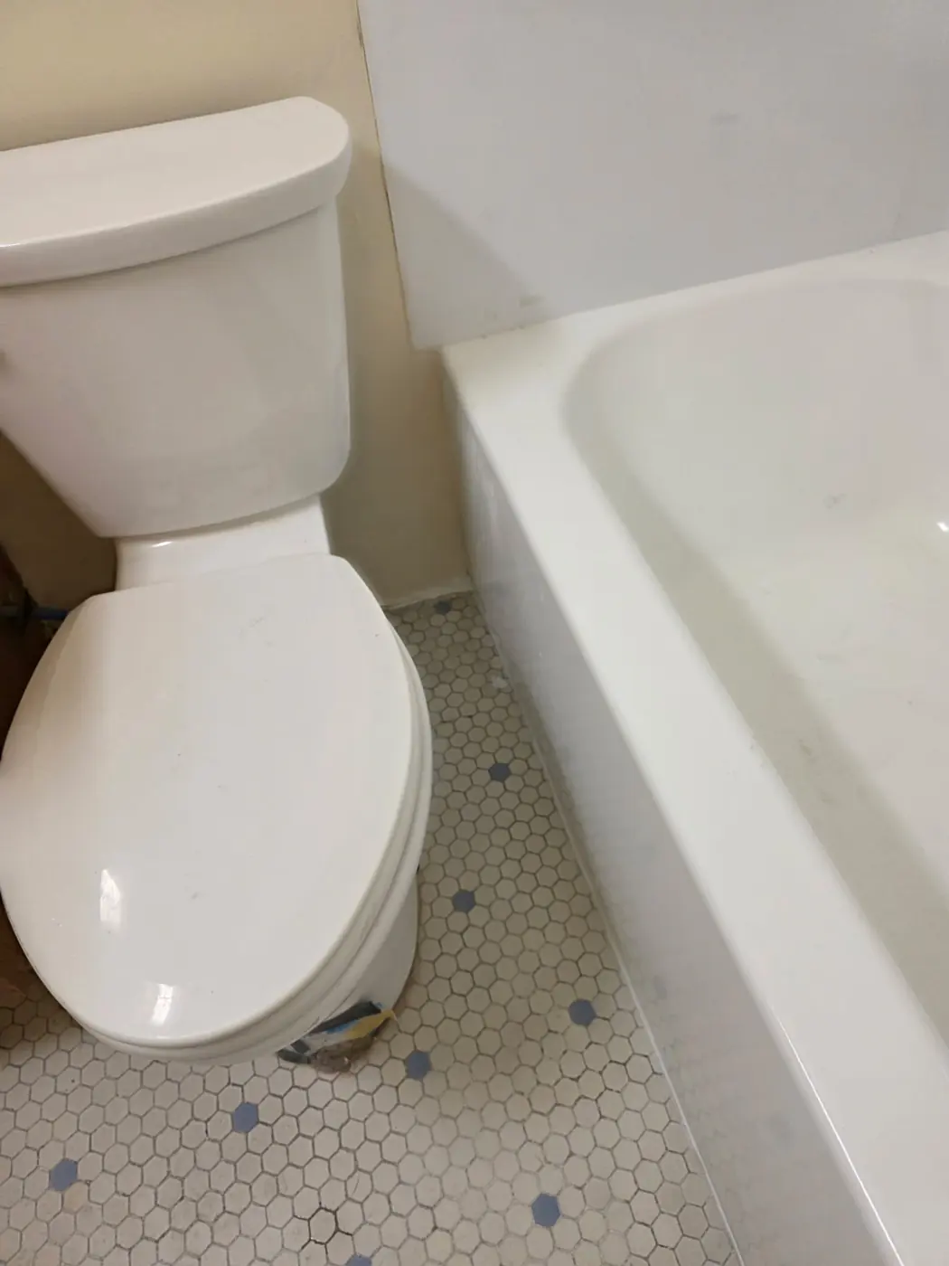 Fully restored Denver bathroom with new tub, clean tile floor, antimicrobial primer and fresh latex paint